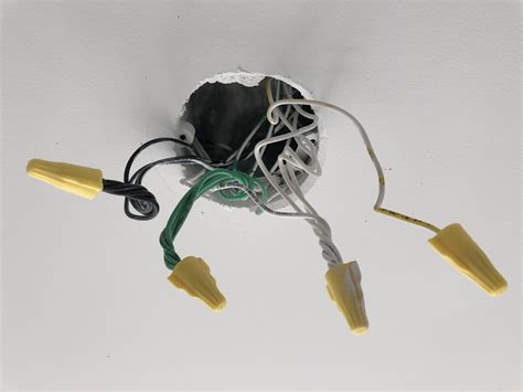 electrical box has multiple sliver wires and a green wire|light fixture box black wire.